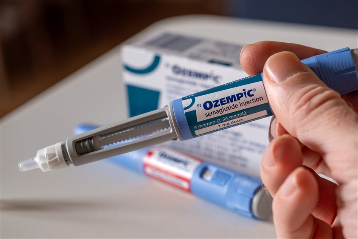 Photo showing a person holding an Ozempic vial.  Novo Nordisk enhances Wegovy making it a triple threat in the treatment of type 2 diabetes and weight loss.