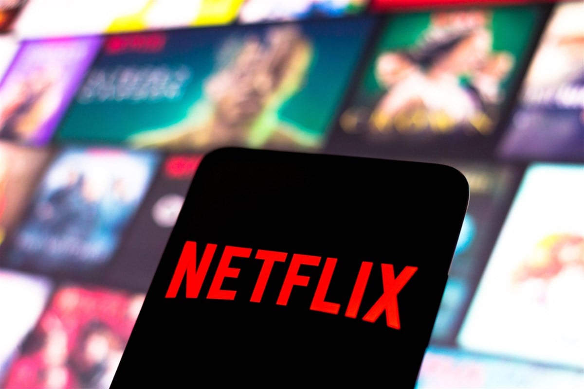 the Netflix logo is displayed on a smartphone screen