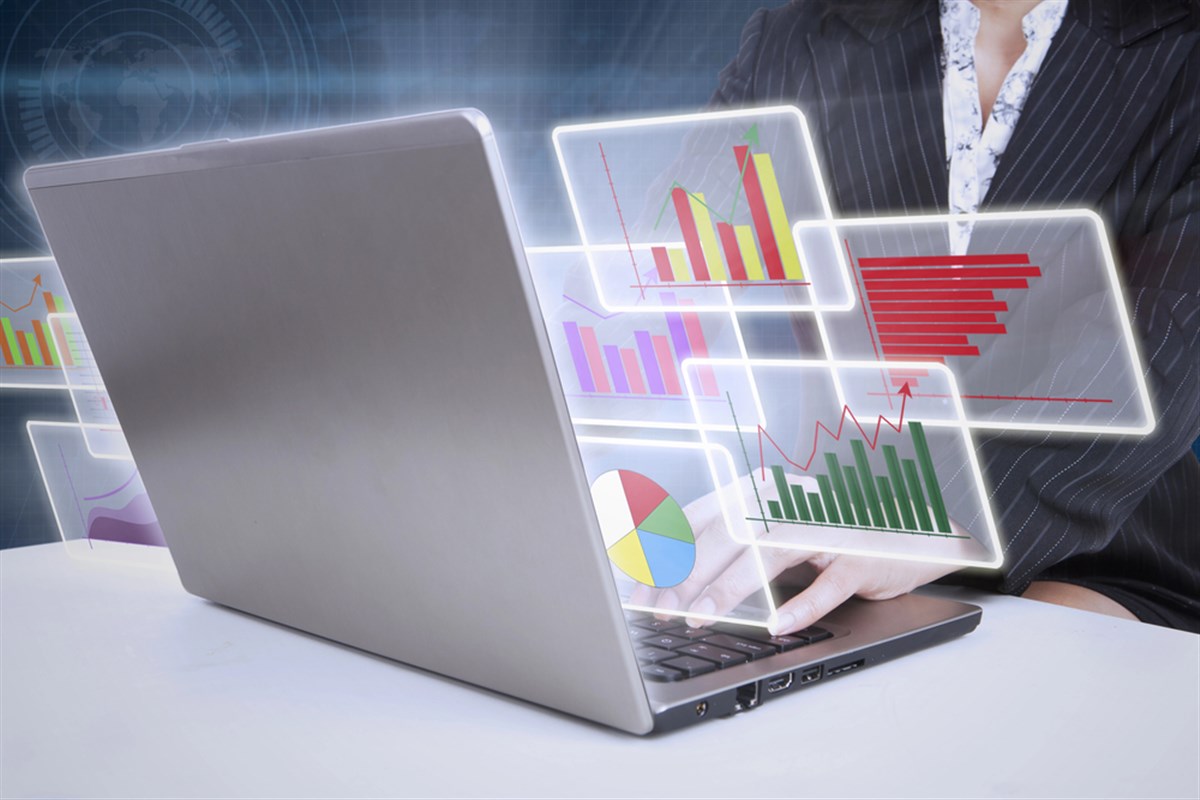 Photo of a laptop projecting holograms of charts, alluding to company analysis. Here are 3 value stocks you can buy before they become big.