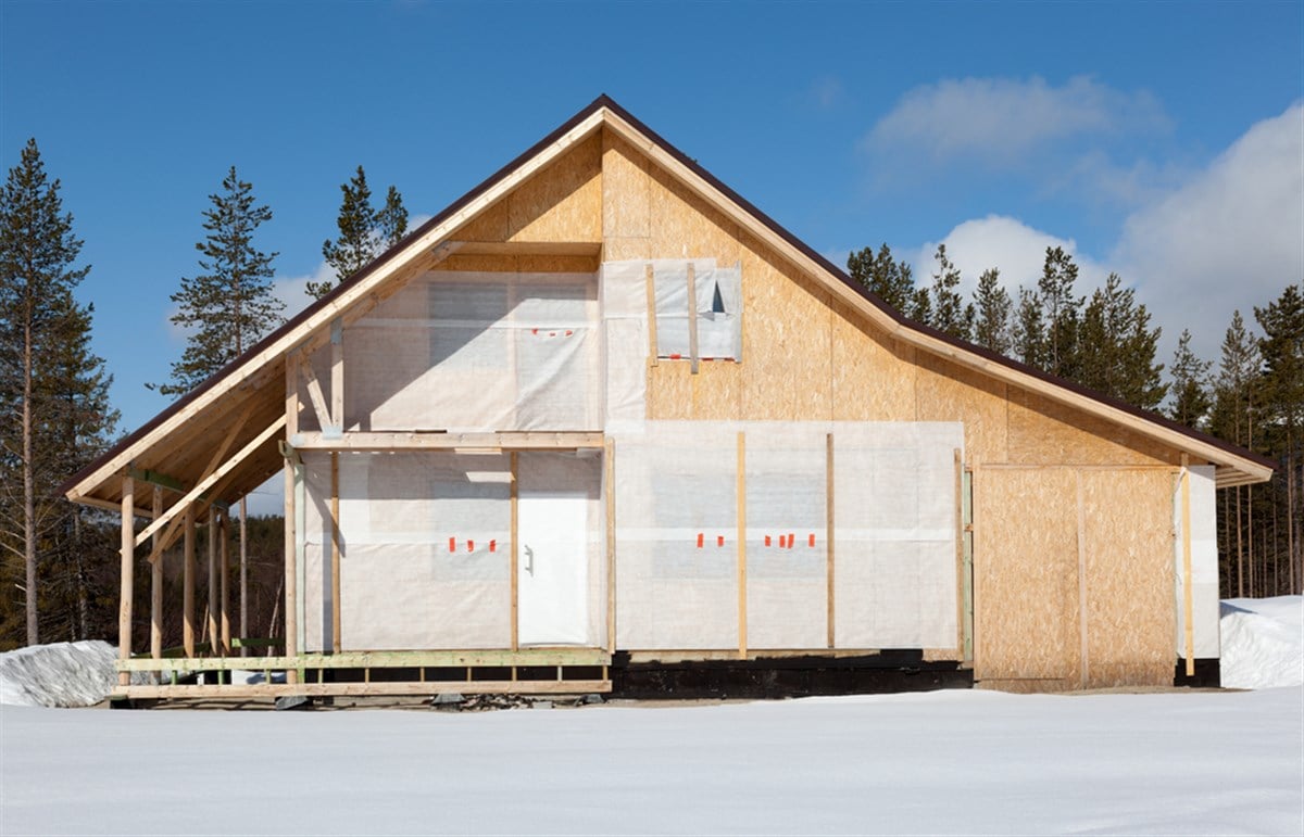 Photo of a new construction home in the process of being built. PulteGroup Profits Surge as Rate Cuts Boost Housing Market.