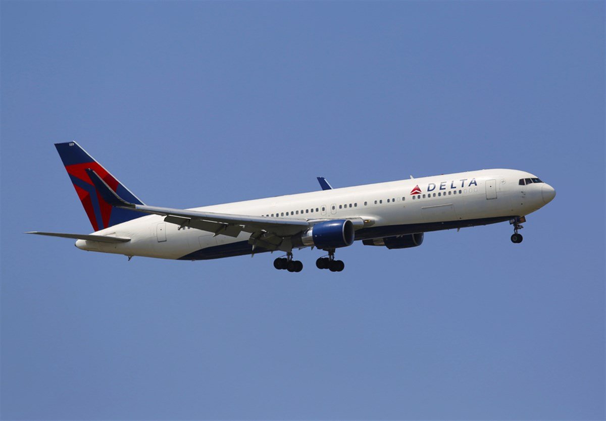 Delta airlines plane in the sky, no clouds