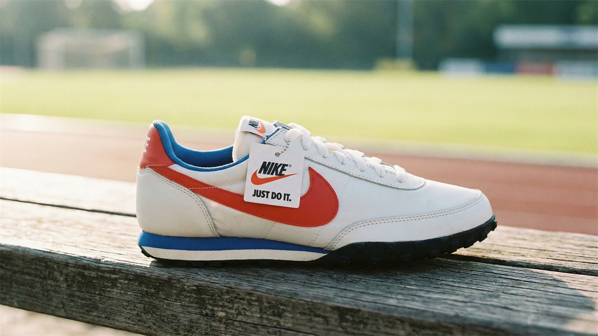 Nike athletic sneaker with red swoosh on a bench beside a running track, symbolizing the brand’s consumer footwear business and market rebound theme.