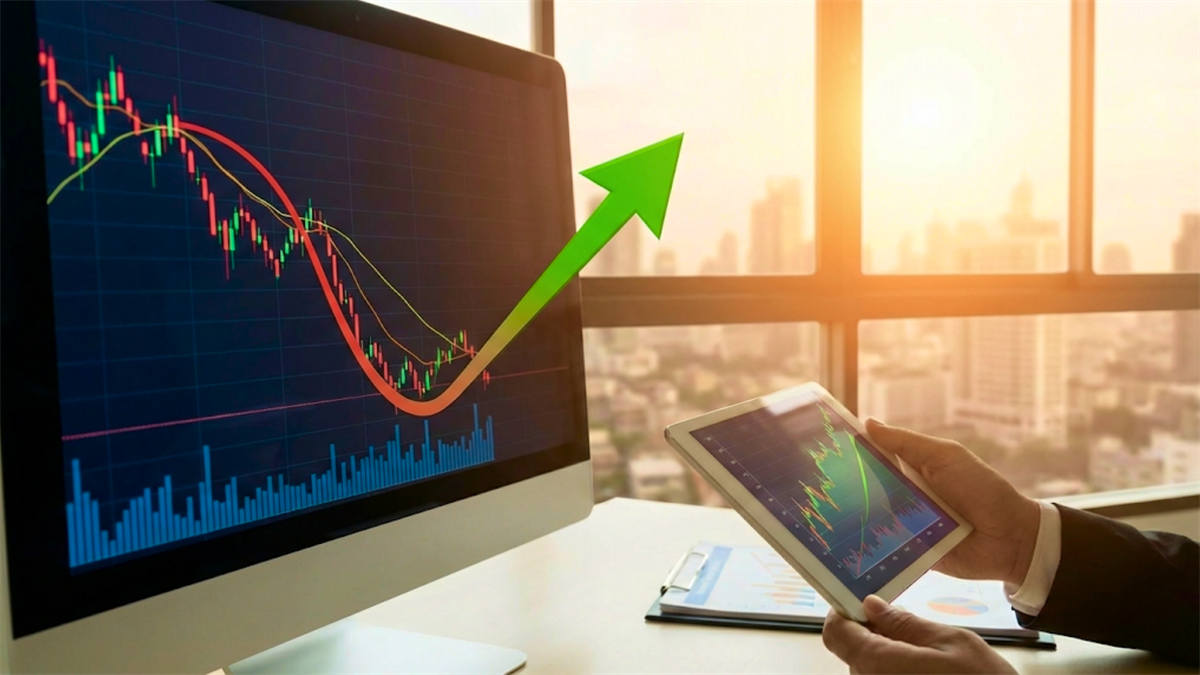 Trader views candlestick chart on monitor with green up arrow, signaling stock rebound amid market optimism.