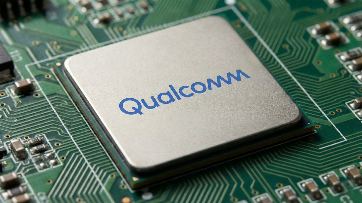Close-up of a Qualcomm-branded microchip on a green circuit board, representing the semiconductor industry.