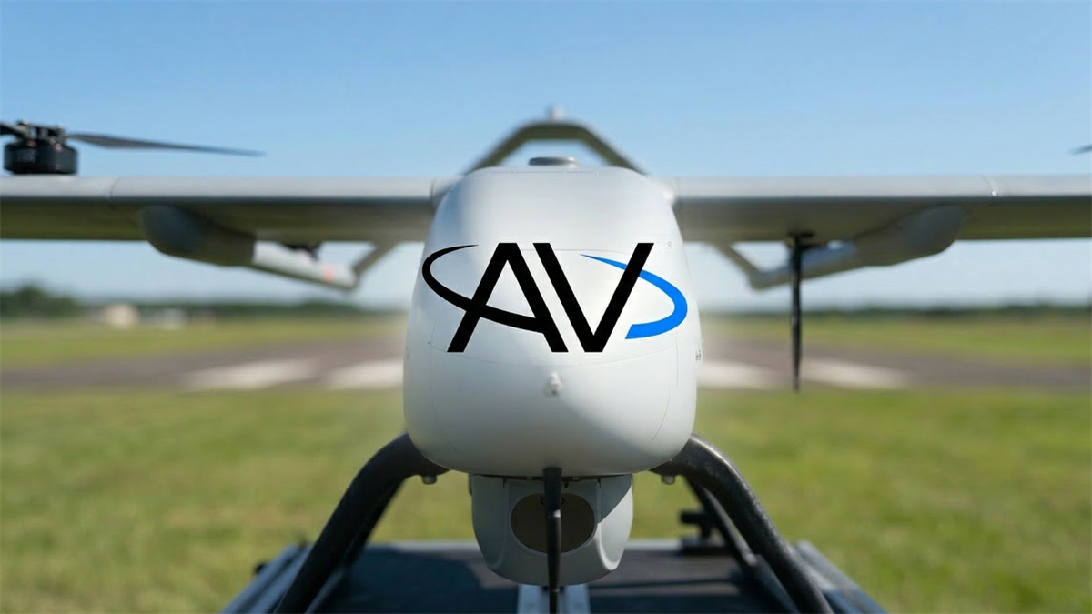 Autonomous military drone with AV-style logo on the nose sitting on a runway, representing AeroVironment and the defense drone industry.