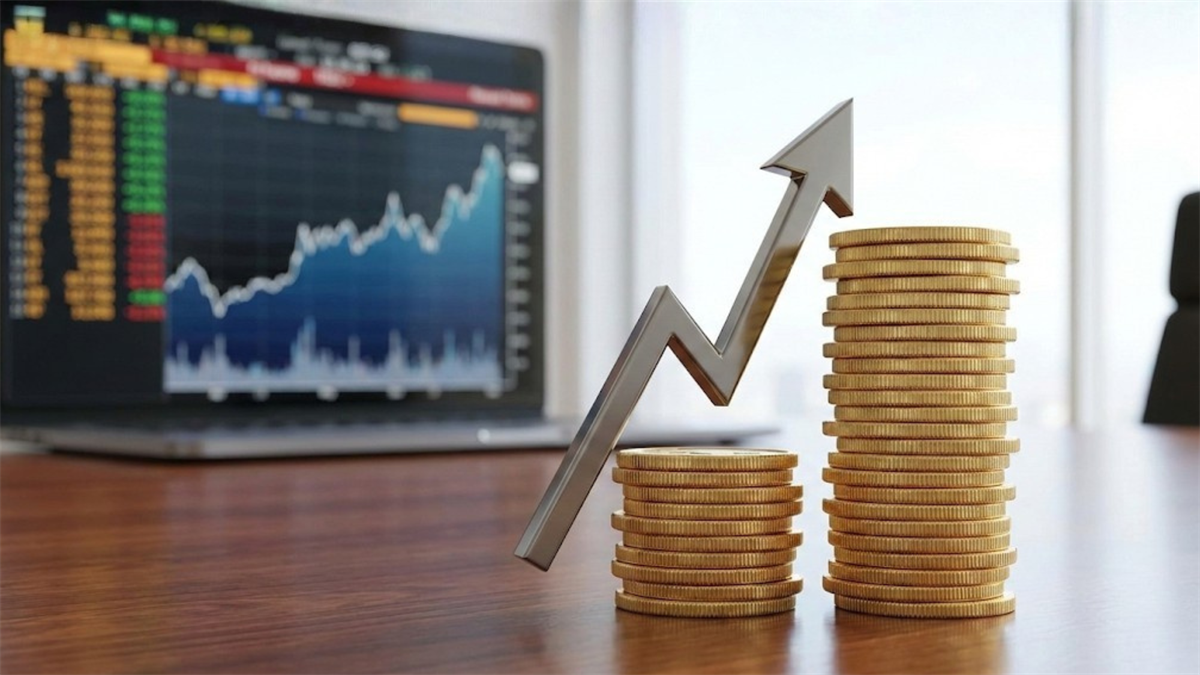Rising stacks of gold coins with an upward arrow in front of a stock market screen, symbolizing dividend growth investing.