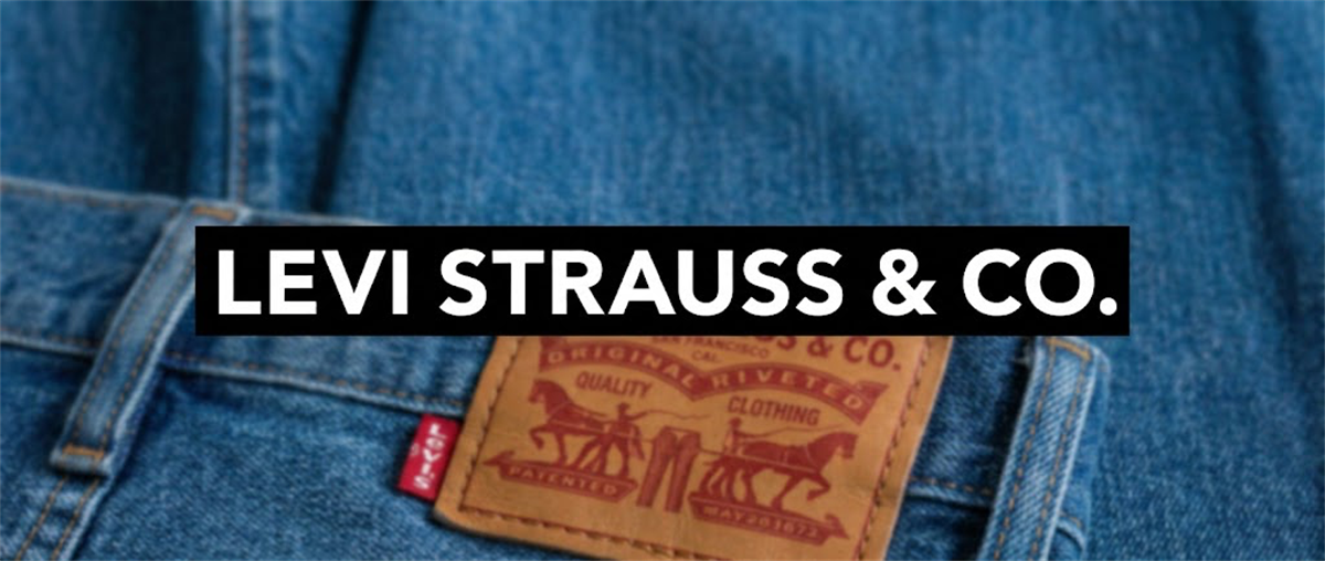 Close-up of denim jeans with a leather patch and back pocket, overlaid with the Levi Strauss & Co. name.