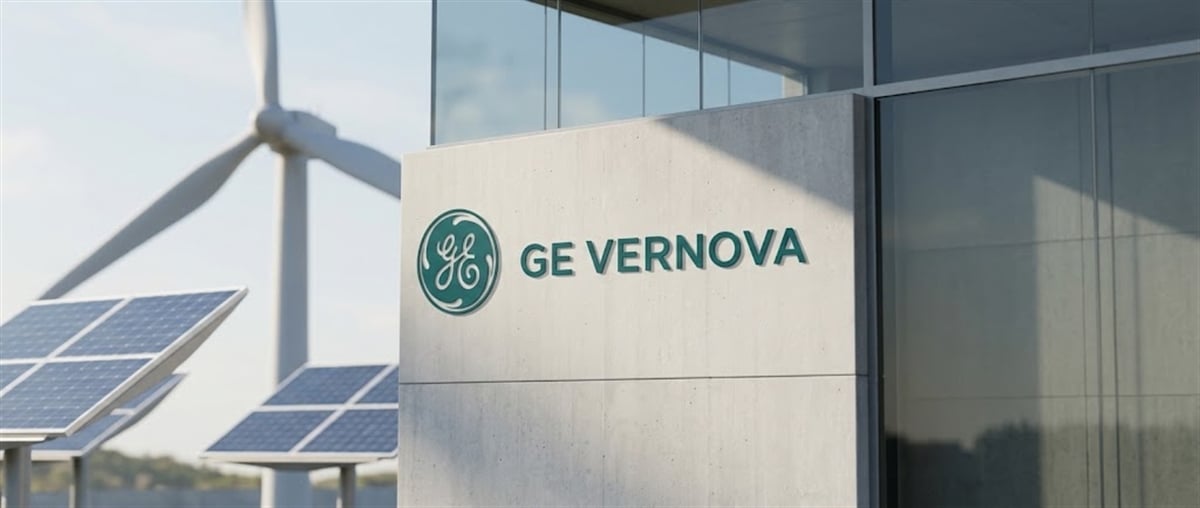 GE Vernova logo on a building exterior, with a wind turbine and solar panels visible nearby.