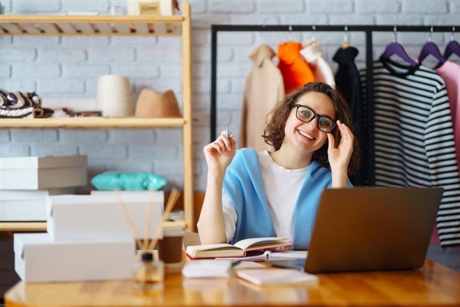 Woman investing in online retail stocks 