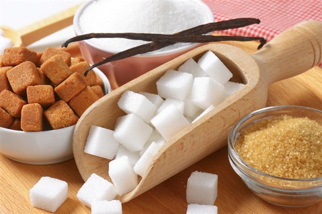 Still life of various types of sugar; learn more about sugar stocks to invest in on MarketBeat