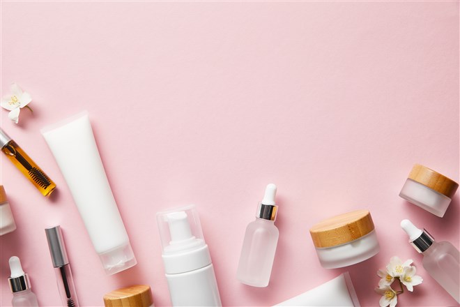 photo collage of cosmetics and skin care products on pink background