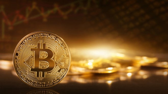 Gold bitcoins on a yellow background