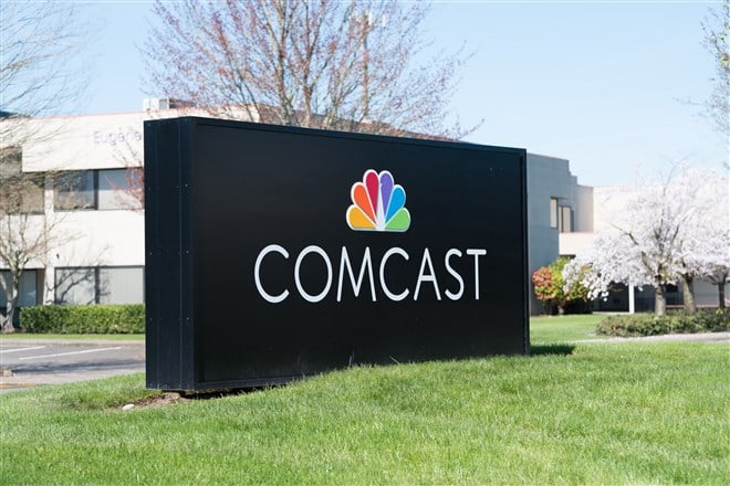 photo of comcast sign and logo outside one of the company's office buildings