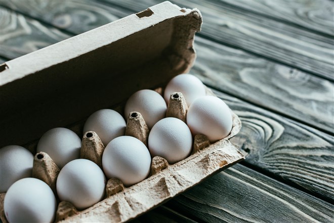 photo of open carton of white eggs