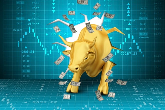 Rising golden business bull with graph stock analysts 