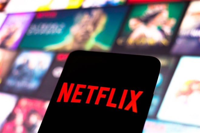 the Netflix logo is displayed on a smartphone screen