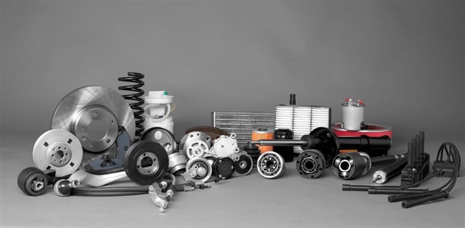 Photo of a collection of auto parts. 3 Auto Parts Makers Achieving Double-Digit Growth.