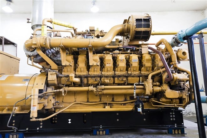 Photo of a large generator. Generac Leads Electrification: Key Strategies and Impact.