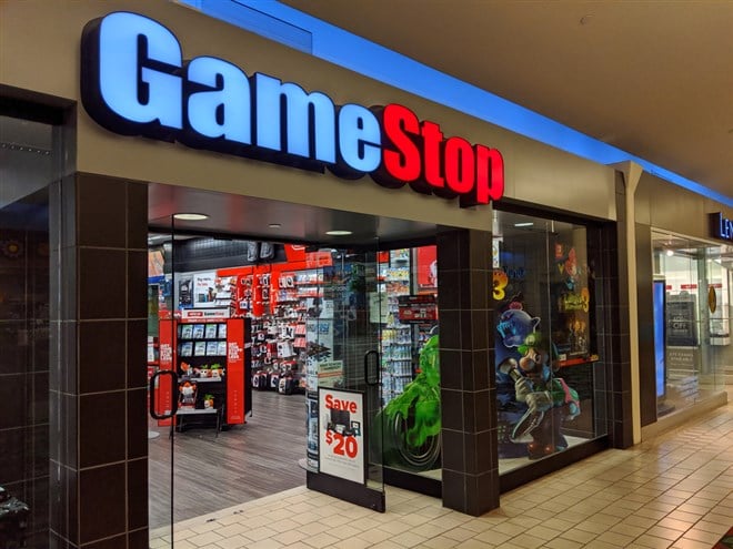 Gamestop store with Luigi's Mansion ad in window in Kahala Mall shopping center