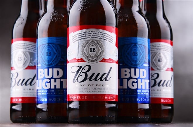 Photo of close ups of Bud and Bud Light bottles. Anheuser-Busch Boosts Efforts to Reclaim Top Spot in Beer Market.