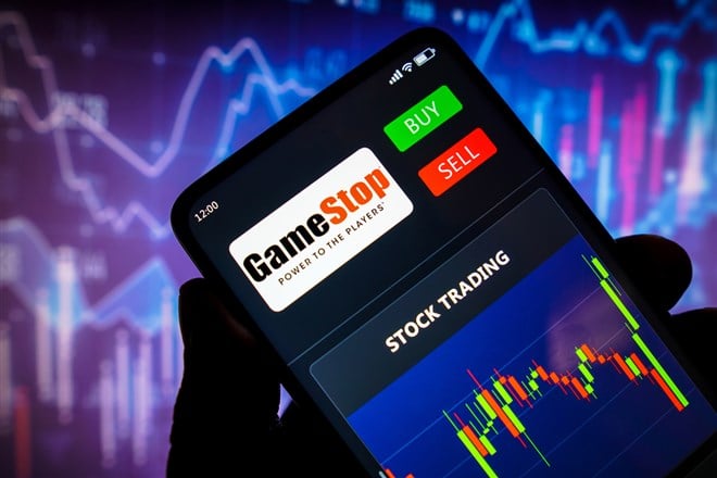 In this photo illustration the stock trading graph of GameStop seen on a smartphone screen