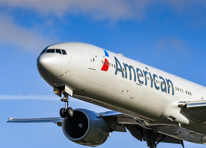 American Airlines Boeing 777 long haul airliner landing at London Heathrow Airport.