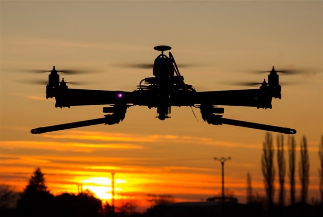 Hexacopter drone flying in the sunset — Photo