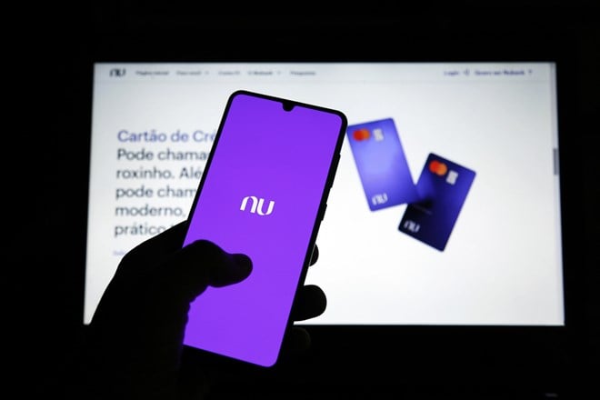mobile phone display and site with new Nubank brand. Digital payment system