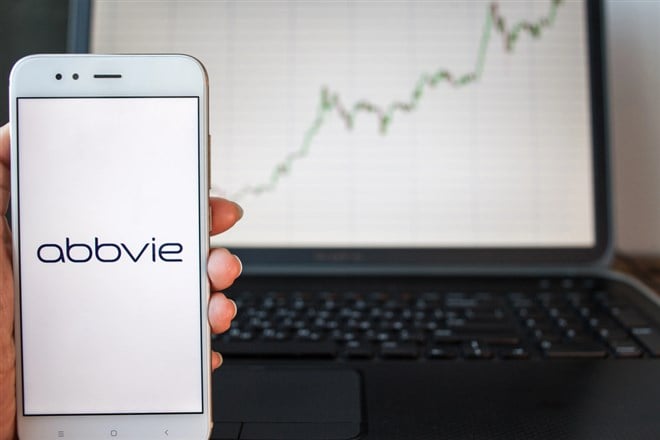 AbbVie logo in front of rising stock chart 