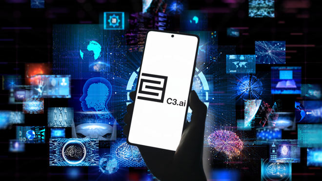 C3.ai logo on smartphone over artificial intelligence background.