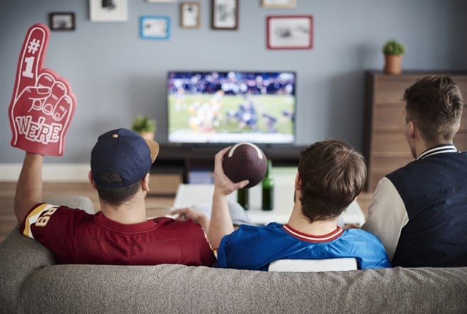Fans watching American football.