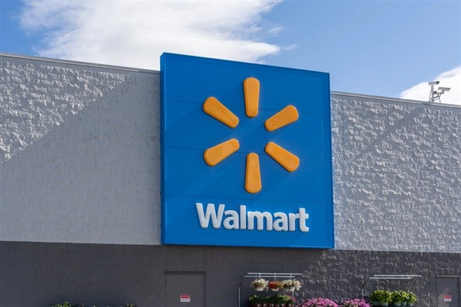 Walmart storefront against blue sky. 