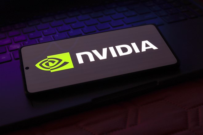 Nvidia logo displayed on a smartphone over a keyboard highlights chipmaker's AI demand outlook and stock momentum.