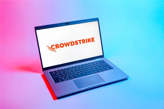 CrowdStrike logo displayed on laptop.