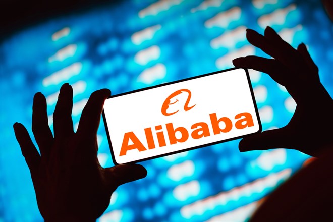 Mobile phone displaying the Alibaba logo.