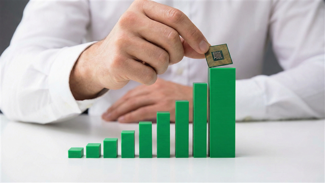 Hand placing a microchip on top of rising green bar chart, symbolizing growth in semiconductor stocks.