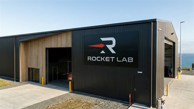 Imaginative depiction of a Rocket Lab facility with company logo on modern industrial building near coastline