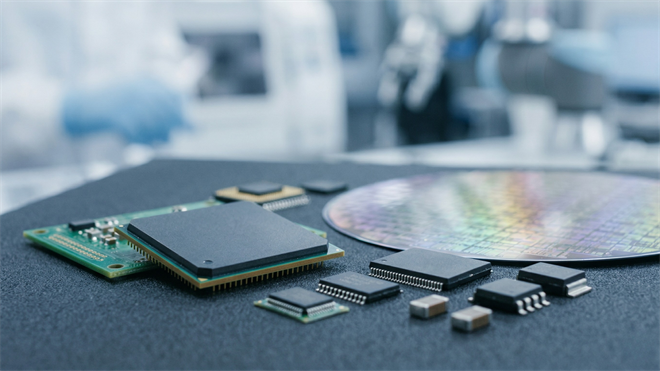 Close-up of semiconductor chips and silicon wafer, representing AMD and AI-driven growth in the semiconductor industry.