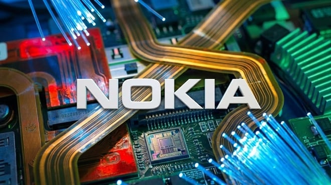 Nokia logo on an intricate circuit board with glowing fiber optics.