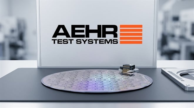Aehr Test Systems logo displayed above a semiconductor wafer and chip component in a lab setting.