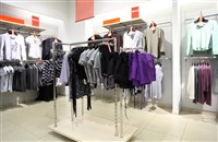 Interior of shop of clothes: Which type of specialty retail store should you invest in?