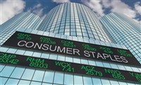 Consumer staples graphic in style of stock ticker with skyscraper in background