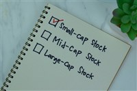 notepad with small-cap stock checked off list