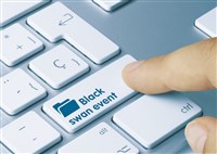 Black swan event words on key of computer keyboard with finger 