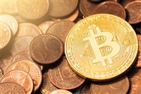 closeup photo of a representation of Bitcoin as a gold coin