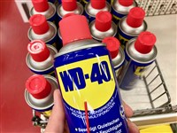 Photo: Cans of WD-40 in a shopping cart; WD-40 Experiencing Growth and Profits in Q2