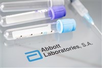 Photo showing Abbott Laboratories logo and two medicine vials. Abbott's outlook is healthy - is it time to buy the dip?