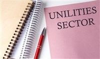 Utilities Sector word on pink paper with office tools on white background