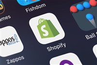 photo of mobile device screen displaying shopify logo