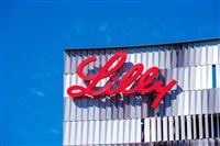 photo of Eli Lilly logo hanging on one of the company's office buildings